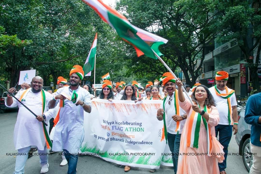 Walkers carrying the Flagathon banner along the route